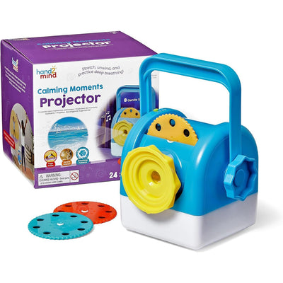 Calming Moments Projector in blue and yellow with accessories and packaging, designed for relaxation and mindfulness activities.
