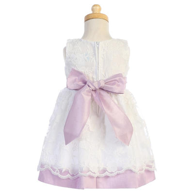 Lito Baby Girl Dress in lilac with embroidered mesh, poly silk trims, and a large satin bow at the back.