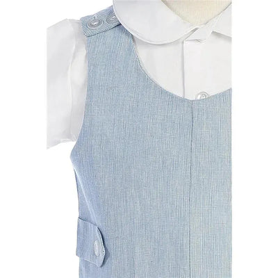 Cotton linen overall set in blue featuring button details, paired with a white collared shirt underneath.