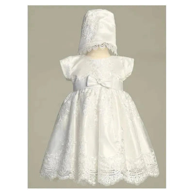White embroidered tulle dress with matching bonnet, featuring lace details and a satin bow at the waist.
