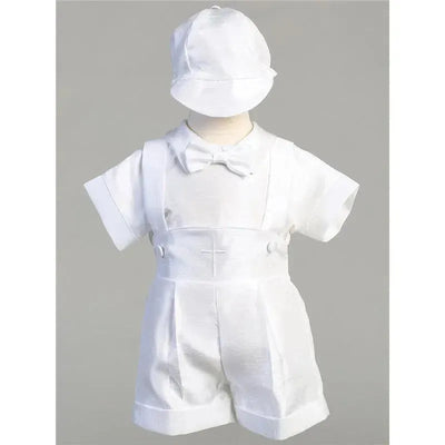 White suspender shorts with embroidered cross and matching cap, designed for young boys.