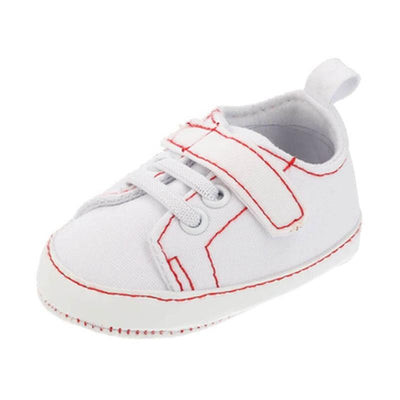 Little Me Baby Boy Sneaker in white with red stitching and a Velcro strap for easy wear.