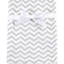 Coral fleece baby blanket in gray chevron pattern, tied with a white ribbon for secure display.