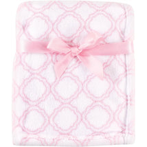 Coral fleece baby blanket in a pink lattice pattern, tied with a pink ribbon.