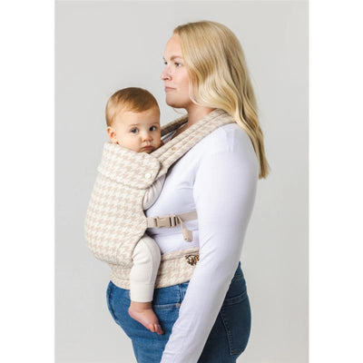 Mabe Monarch Carrier in houndstooth beige being used by a woman to carry a baby securely.