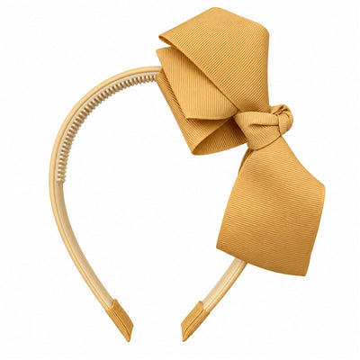 Yellow headband with a large bow, attached to a MacroBaby tag displaying price and branding.