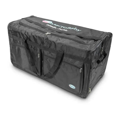 Black travel bag with corner wheels, featuring multiple zippered pockets and the MacroBaby logo.