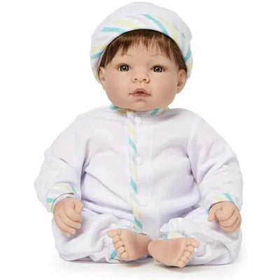 Madame Alexander Munchkin doll with light skin tone, blue eyes, and brown hair, dressed in a white outfit with pastel stripes.