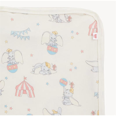 Dumbo-themed modal blanket featuring playful circus elephant illustrations, stars, and a striped tent design.