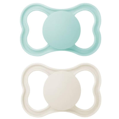 Two Mam Air Matte pacifiers in mint green and soft white, designed for infants 16 months and older.