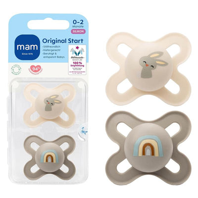 Two Mam Original Start matte baby pacifiers for 0-2 months, one with a bunny and one with a rainbow.