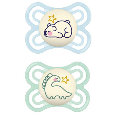 Two baby pacifiers designed for boys, featuring a sleeping bear and dinosaur, glow in the dark, suitable for ages 0-6 months.