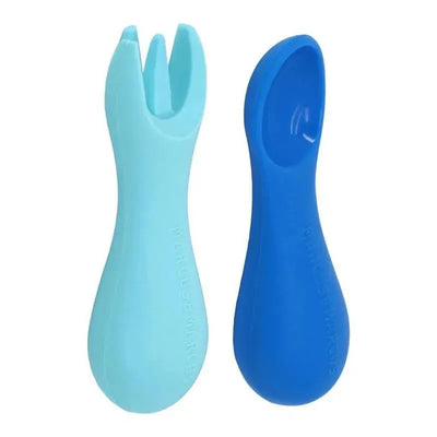 Silicone spoon and fork set in blue and light blue, designed for toddlers to encourage self-feeding.