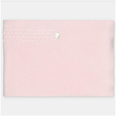 Sweater knit cotton blend blanket in baby pink featuring decorative stitching and a button detail.