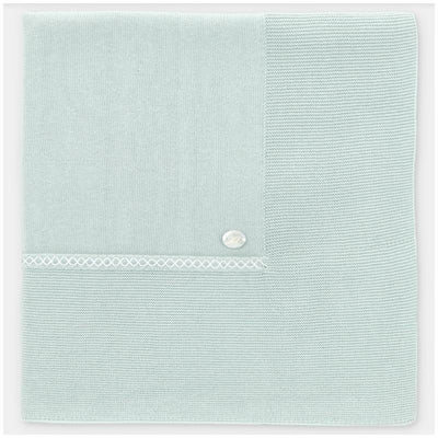 Pastel blue Martin Aranda knit blanket with textured sections and a decorative button detail. One size.