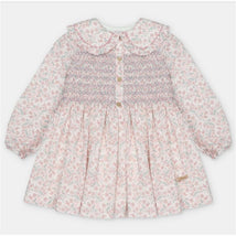 Martin Aranda dress featuring an all-over floral print, smocked bodice, and button detailing, designed for children.