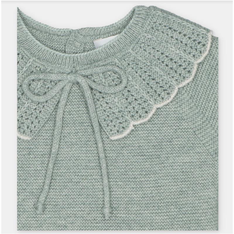 Light green sweater featuring a textured crochet collar and a bow tie at the neck, part of the Martin Aranda set.