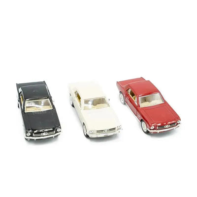Three toy Ford Mustang model cars in black, white, and red, showcasing detailed craftsmanship and design features.