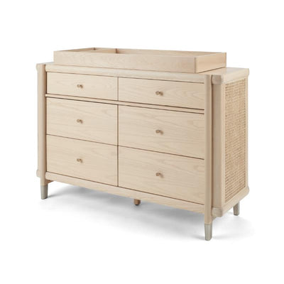 Maxi-Cosi Nursery Brisa 6-Drawer Dresser in natural wood finish with a changing top and woven side detail.