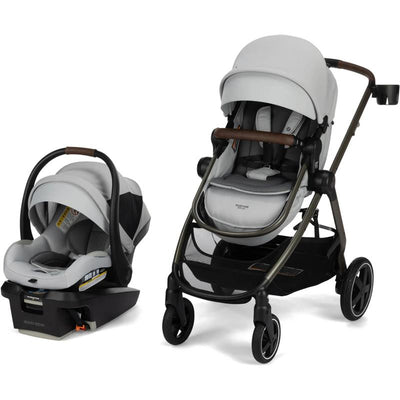 Maxi-Cosi Zelia Luxe Travel System in Arctic Frost, featuring an infant car seat on a base and a stroller with a sleek design.