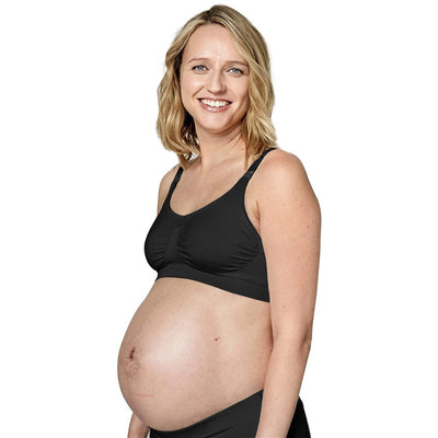 Maternity and nursing bra for breastfeeding in black, worn by a smiling pregnant woman.