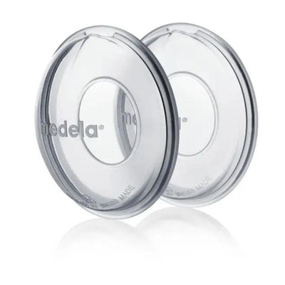 Milk collection shells by Medela, clear design with an inner opening, ideal for collecting breast milk.