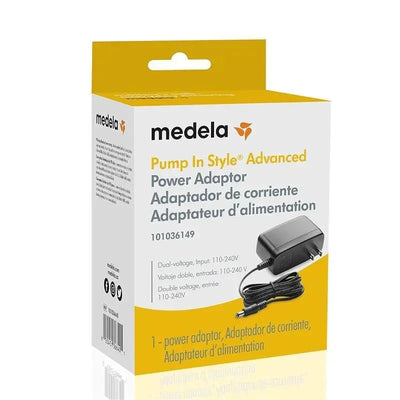 Medela Pump in Style Advanced power adaptor packaging, featuring dual-voltage input and product details in multiple languages.