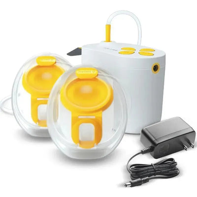 Hands-free Medela Pump in Style Breast Pump kit with two yellow breast shields, a white pump unit, and a power adapter.