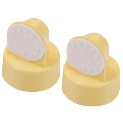 Spare valves and membranes for Medela breast pumps, featuring a yellow base and white membrane with textured surface.