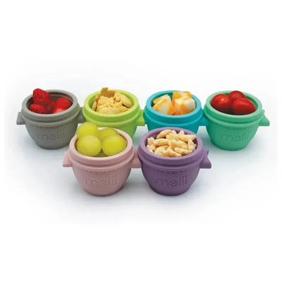 Six colorful Melii 2 oz baby food storage containers filled with various snacks: strawberries, grapes, crackers, and more.