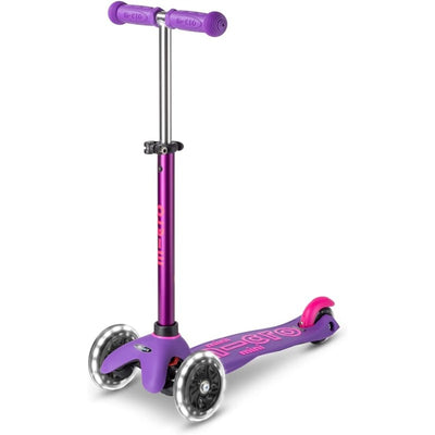 Micro Kickboard Mini Deluxe LED scooter in purple, featuring three wheels and colorful LED lights on the wheels.