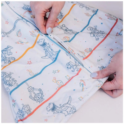 Milk Snob Toy Story baby sleep bag with playful character designs, featuring a zipper for easy use, suitable for 0–6 months.