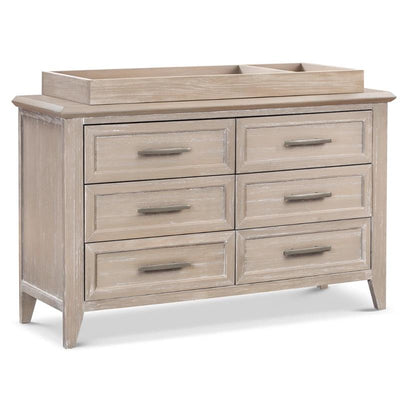 Universal wide removable changing tray in sandbar color atop a six-drawer dresser, featuring sleek drawer handles.