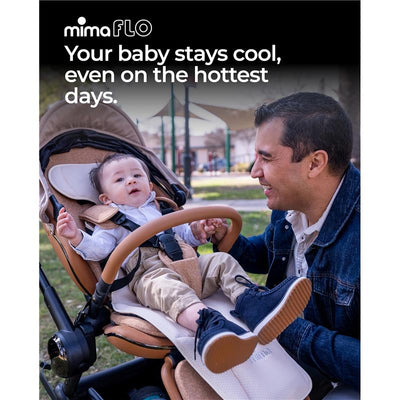 Mima Flo Baby Cooling Seat Liner in Donut Beige, featuring a baby comfortably seated in a stroller on a sunny day.
