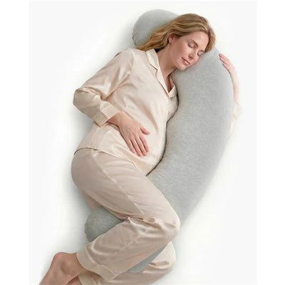 Maternity body pillow providing support to a pregnant woman in silk pajamas, promoting comfort during sleep.