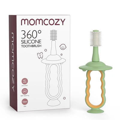 Green Momcozy 360° silicone toothbrush for infants, featuring a textured handle and soft bristles. Suitable for ages 12+.