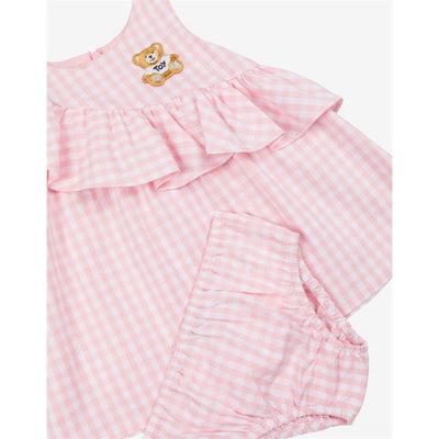 Ruffled gingham dress with bloomers for girls by Moschino Baby, featuring a light pink check pattern and teddy bear embroidery.