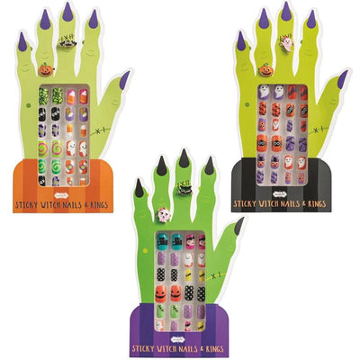 Black Halloween nail set featuring assorted designs, displayed on a green witch hand-shaped card.