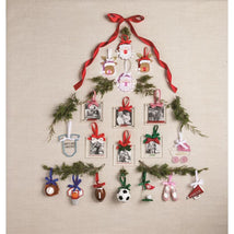 Red Bow Frame Ornament displayed as part of a Christmas tree arrangement with various seasonal ornaments and photo frames.