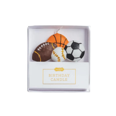 Figural birthday candle set featuring sports balls: football, basketball, baseball, and soccer, presented in a gift box.