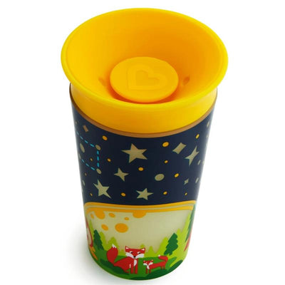9 oz Munchkin Miracle® 360° Glow In The Dark Sippy Cup with a yellow top, featuring a night sky design and playful fox graphics.