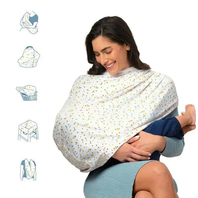 Munchkin 5-In-1 Antimicrobial Cover in Quiet Skies pattern, used by a smiling woman to cover a baby during nursing.