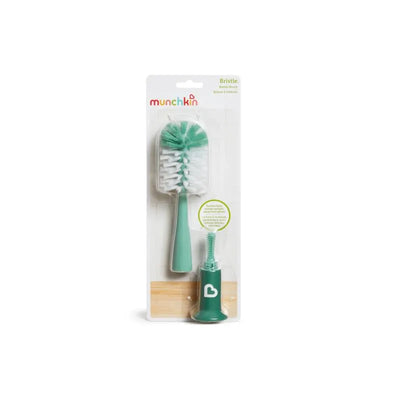 Bristle bottle brush in teal color with a brush head and a smaller nipple cleaner, packaged by Munchkin.