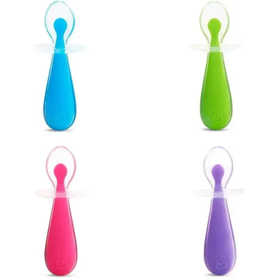 Munchkin Gentle Scoop Silicone Training Spoons in blue, green, pink, and purple, designed for toddler feeding.