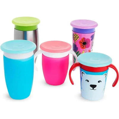 Four colorful Munchkin Miracle 360 Cup lids with different designs on respective cups, including a polar bear and floral patterns.