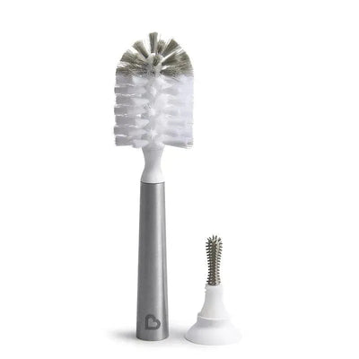 Stainless steel bottle brush with a white bristle head, featuring a detachable silicone scrubber for cleaning narrow bottles.