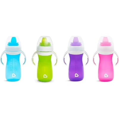 Purple Munchkin sippy cup among three other colorful sippy cups with handles, designed for toddlers.