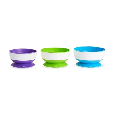 Suction bowls in purple, green, and blue, designed to prevent spills during mealtime, are displayed in a 3-pack.