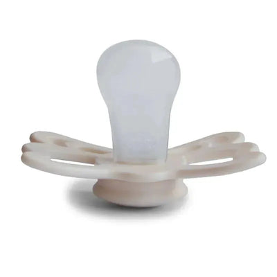 Silicone pacifier in cream and blush colors with a butterfly design, suitable for infants aged 6 to 18 months.