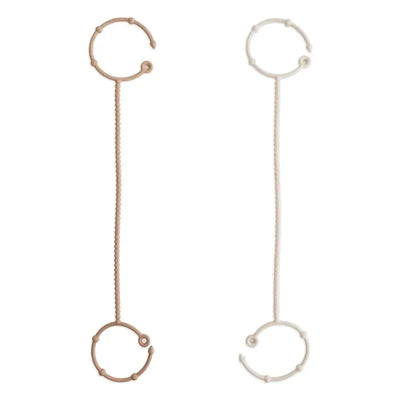 Adjustable silicone straps in natural and shifting sand colors, designed for versatile use.